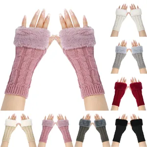 Women's cable knit fingerless gloves with faux fur cuffs for winter warmth and style.