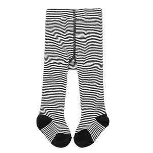 Classic baby footed tights with black and white horizontal stripes for festive holiday wear