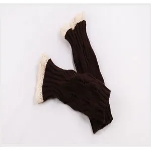 Detail view of brown cable-knit fingerless arm warmers with elegant cream lace trim detail