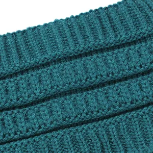 Close-up of peacock blue ribbed knitted fabric for women's winter headband.