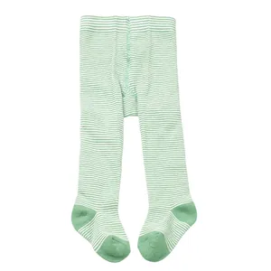 Detail shot of infant green and white striped footed leggings with reinforced toes