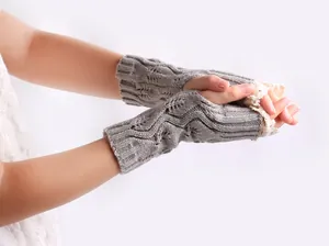 Detailed view of grey knit fingerless gloves with elegant white lace trim for women winter.
