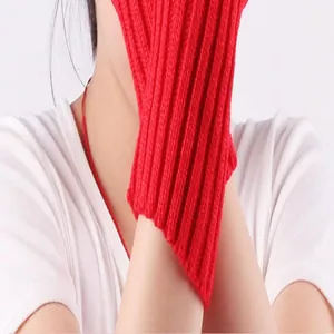 Close-up of red knitted fingerless arm warmers showing the ribbed texture and fit
