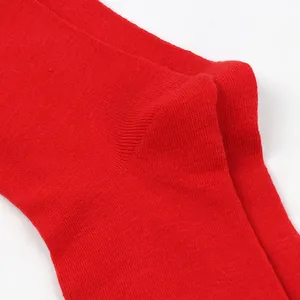 Detailed close-up showing the soft red knitted texture of children's long tube socks