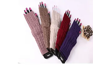 Detailed view of long cable knit fingerless arm warmers in multiple warm winter colors
