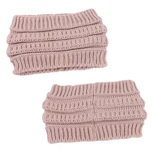 Close-up of two pink knitted ponytail headbands showing soft ribbed wool texture