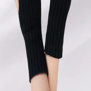 Detail of black ribbed knitted arm warmers made of soft acrylic wool fabric