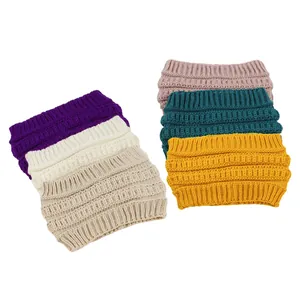 Group of six wide knitted headbands for women shown in various vibrant winter colors