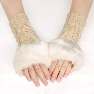 Close-up view of chunky knit fingerless gloves with soft white faux fur trim for women