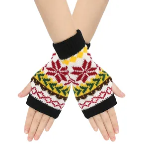 Close-up view of festive knit fingerless gloves with colorful snowflake patterns.