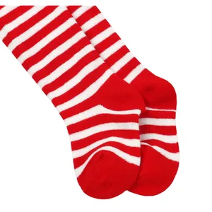 Detailed macro view of red and white striped Christmas holiday leggings for infants and toddlers