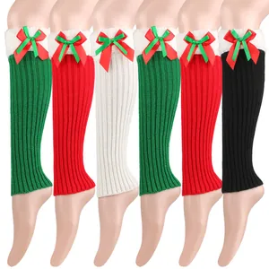 Festive Christmas knit leg warmers with plush trim and satin bow in multiple colors.