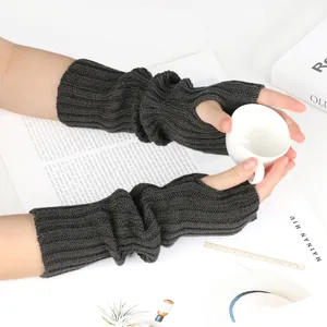 Close-up of dark grey ribbed knit fingerless gloves with thumb hole for women
