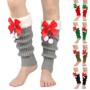 Christmas knit leg warmers with fuzzy cuffs, satin bows, and white pom poms in various colors