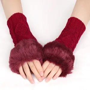 Close-up of burgundy knit fingerless gloves with soft faux fur trim for winter warmth.
