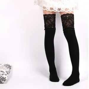 Detailed view of black knitted over-the-knee socks featuring elegant lace floral trim.