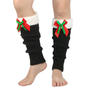 Detail of Christmas leg warmers with plush cuffs and festive red-green bow ties