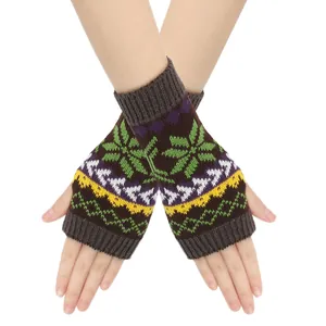 Close-up detail of knitted snowflake pattern on colorful fingerless winter arm warmers
