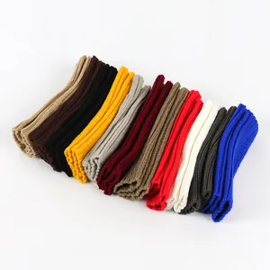 Variety of colorful knitted arm warmers in soft acrylic yarn for winter warmth