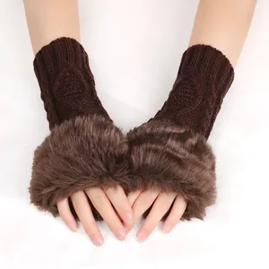 Detail of chunky knit fingerless gloves with plush faux fur trim in brown color
