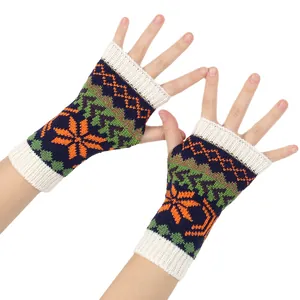 Close-up of colorful Christmas snowflake knit fingerless gloves and winter arm warmers.
