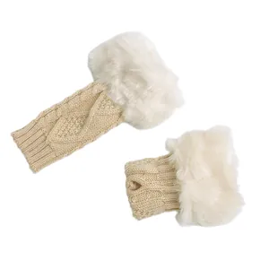 Detailed close-up of cable knit fingerless gloves featuring elegant white faux fur trim.