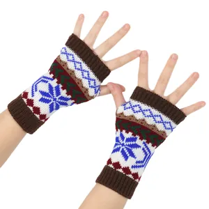 Close-up of winter knit fingerless gloves with colorful Christmas snowflake pattern