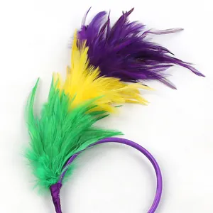 Close-up of vibrant Mardi Gras feather headband in purple, yellow and green colors