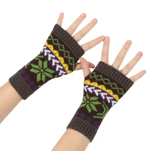 Close-up of knit fingerless gloves with colorful snowflake and geometric patterns