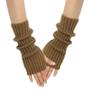 Close-up detail of brown ribbed knit fingerless gloves worn as stylish arm warmers
