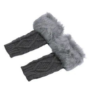 Close-up of grey diamond knit arm warmers with fluffy faux fur trim for winter warmth