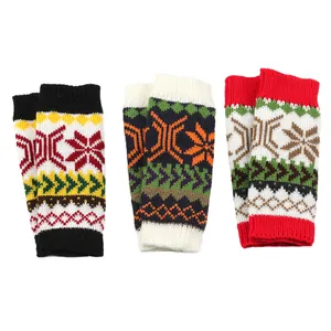 Three sets of knitted Christmas arm warmers with snowflake patterns in various colors