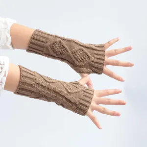 Close-up detail of premium brown cable knit fingerless gloves for winter warmth and style