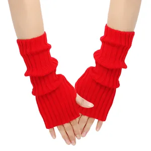 Detailed view of red knitted fingerless arm warmers featuring a stylish ribbed texture.