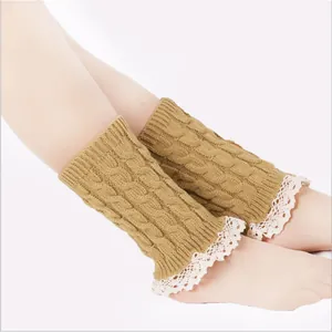 Khaki knitted leg warmers with delicate lace trim for winter warmth
