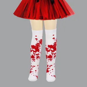 Macro detail view of children's Halloween knee-high socks with red blood splatter