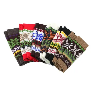 Detailed macro view of colorful knitted Christmas snowflake patterned warm sleeves