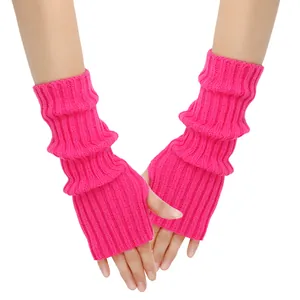 Close-up of bright pink knitted fingerless gloves with ribbed texture for arm warming.