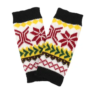 Detailed texture of festive knitted arm warmers with colorful snowflake patterns