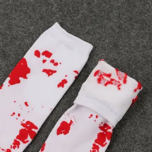 Detail view of Halloween white socks with realistic red blood splatter pattern