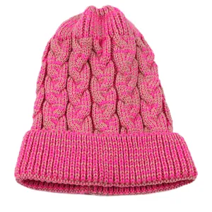 Detailed view of a vibrant pink and beige cable knit beanie featuring a warm ribbed cuff