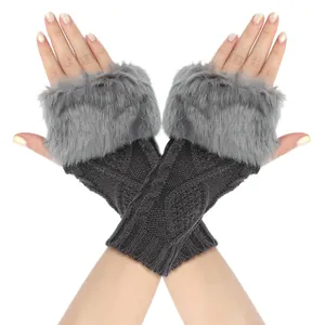 Detail view of grey cable knit fingerless gloves featuring thick plush faux fur trim.
