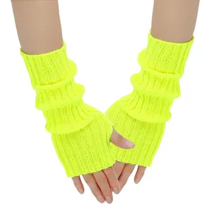 Detailed view of neon green knitted fingerless gloves showing ribbed texture and thumb hole