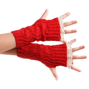Warm red knitted fingerless gloves featuring elegant lace trim for autumn and winter wear