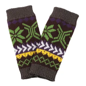 Detailed view of colorful knitted winter arm warmers featuring festive snowflake patterns.