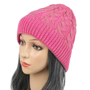 Side view of vibrant pink and brown cable knit beanie shown on a mannequin head