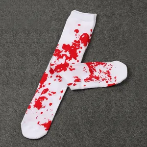 Detailed view of white long socks with realistic red blood splatter pattern for Halloween