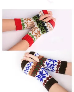 Detail of knitted fingerless gloves with colorful snowflake patterns for winter warmth
