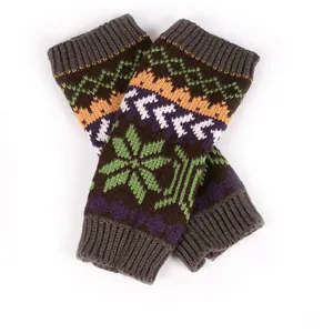 Detail view of colorful knitted fingerless gloves with winter snowflake patterns
