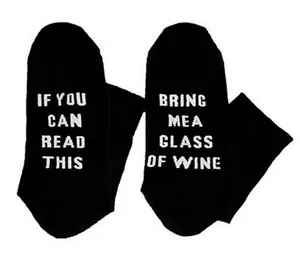 Detailed view of black cotton crew socks with funny wine themed English letter print